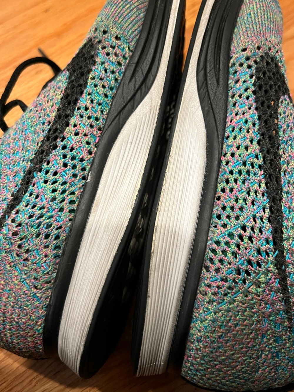 Nike Multicolor Flyknit Sneakers with Black Swoosh - Picture 9 of 9